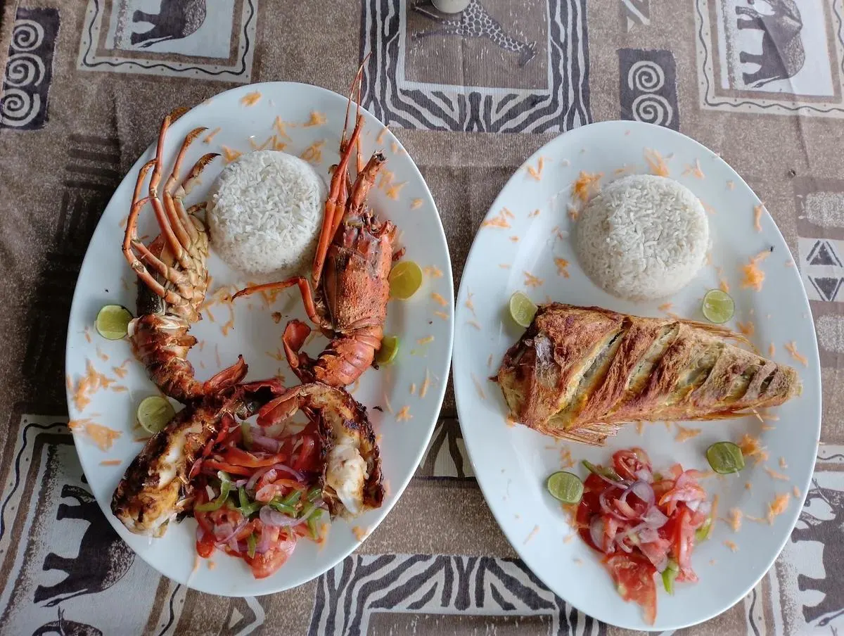 Grilled seafood lunch with fish prawns lobster and coconut rice at Sudi Island Watamu